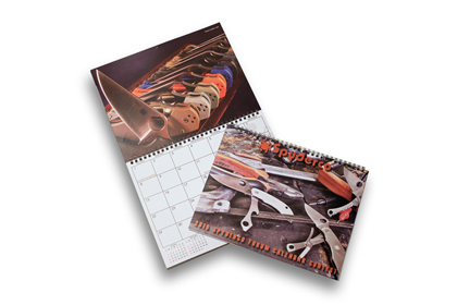The Spyderco 2015 Wall Calendar shown open and closed