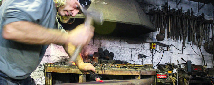 Fred Perrin forging a knife blade.