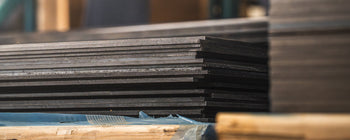 Steel sheets sitting in a warehouse.