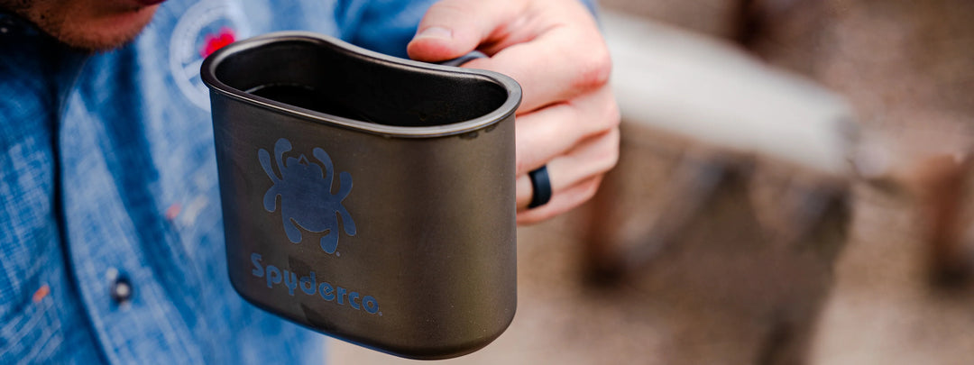 An image of someone drinking coffee from a Spyderco Ti-Cup.