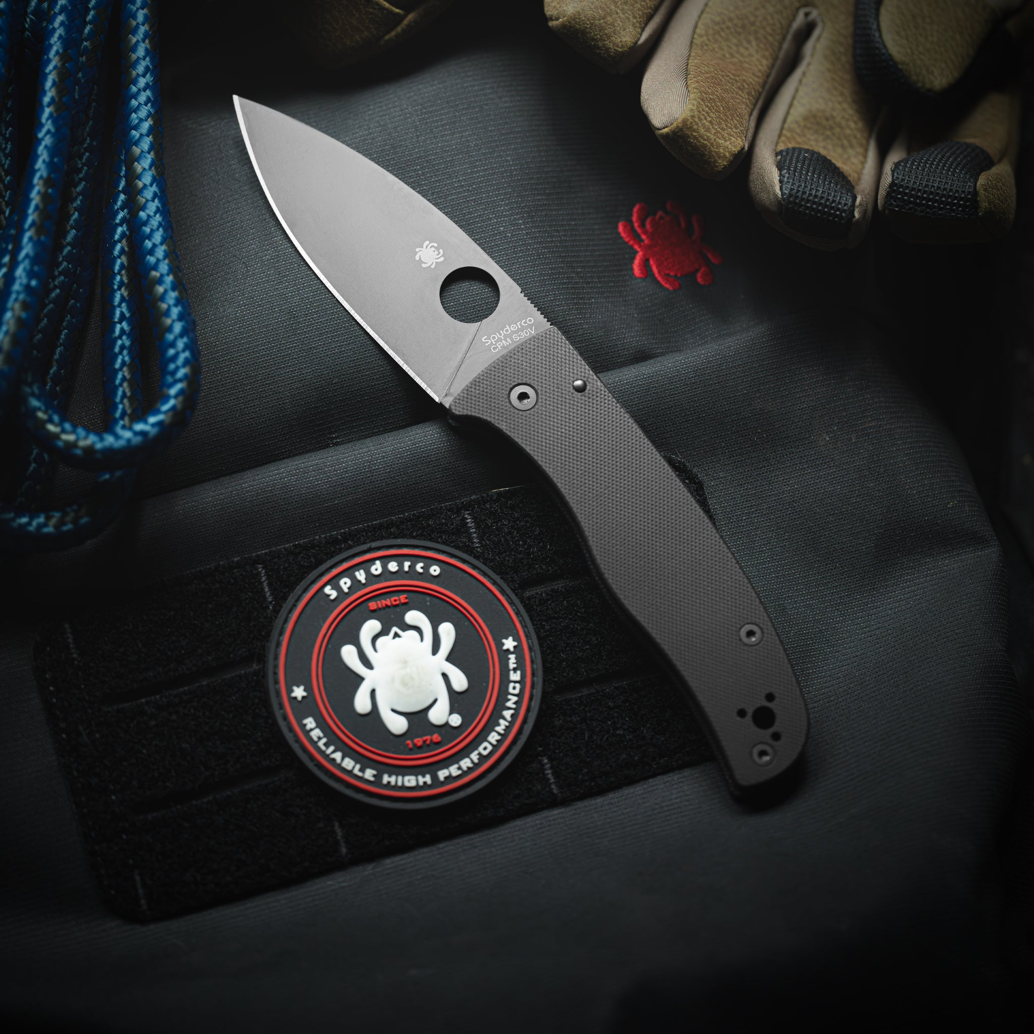 Bodacious™ pictured with a backpack, rope and gloves.